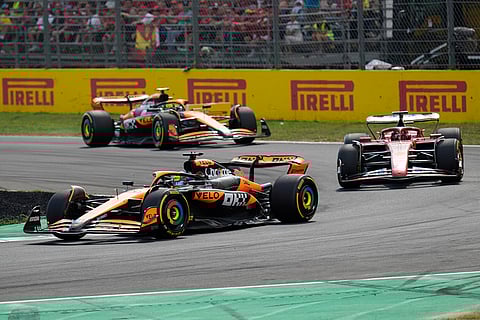 Italian Grand Prix 2024: McLaren driver Oscar Piastri steers his car Ferrari driver Charles Leclerc and McLaren driver Lando Norris
